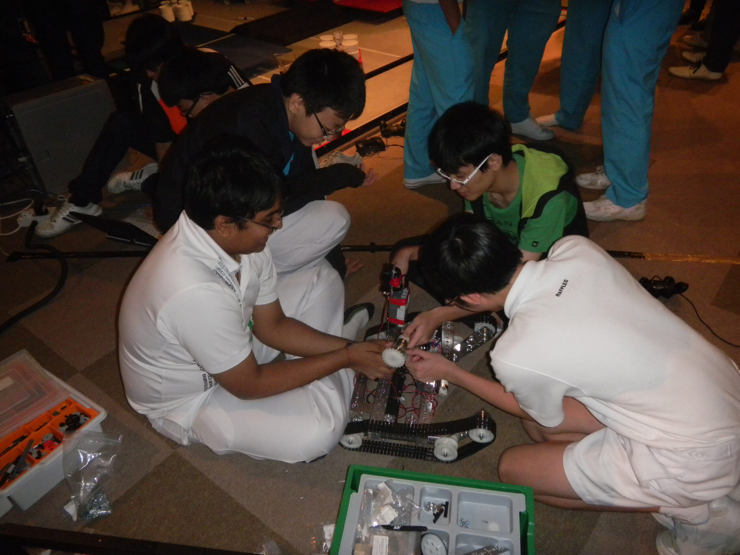 RI Infocomm Club team assembling robot at FTC 2011