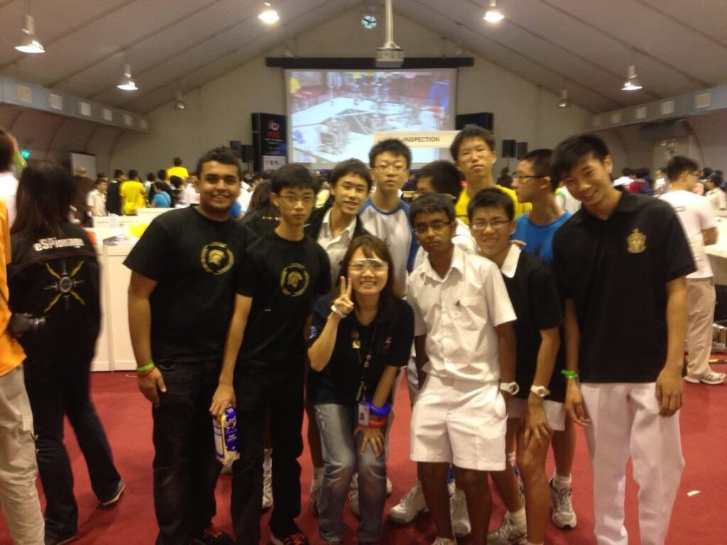 RI Infocomm Club with organiser Kwee Lin at robotics tournament