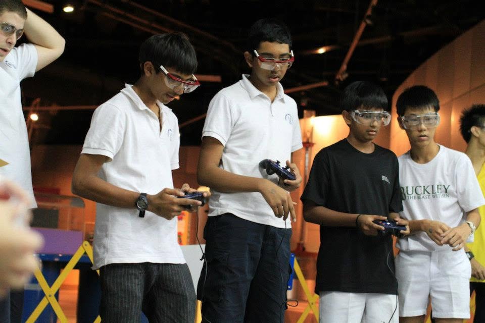 RI Infocomm Club drivers operating robots at FTC 2012