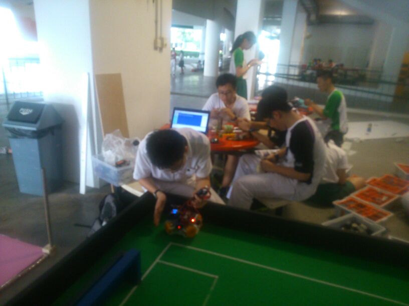 Club Automatica working on RoboCup Singapore Open 2014 robots outside Automatica room