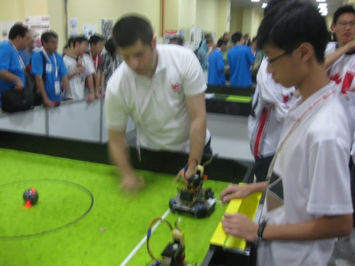 Kenneth with Turkish referee at RoboCup Istanbul 2011 field