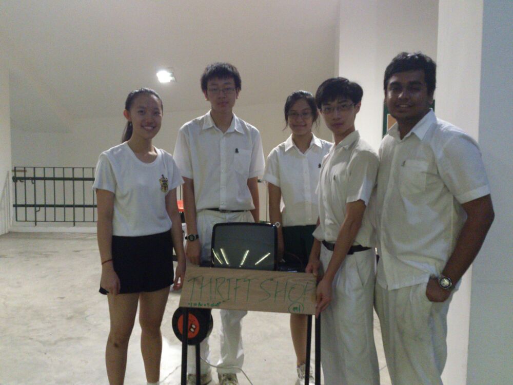 Clarissa, Shen Chen, Athira, Kenneth, and Vishnu posing at “Thrift Shop” installation (2013)